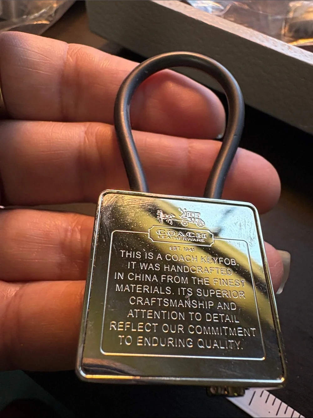 Coach Silver Creed Keychain with Black Pen.